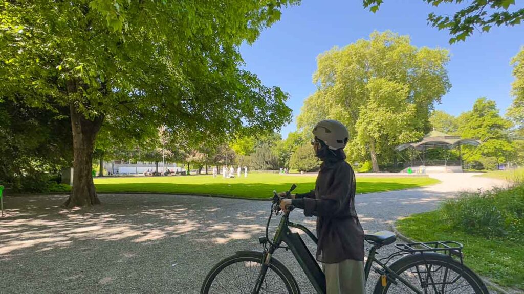 Tracey looking at park goers - Zurich bike tour