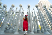 Girl posing in front of LACMA Urban Lights - Los Angeles Attractions