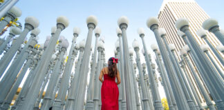 The Ultimate 7-Day Los Angeles Itinerary for First-timers — Pro-tips, Iconic Attractions & National Parks Girl posing in front of LACMA Urban Lights - Los Angeles Attractions