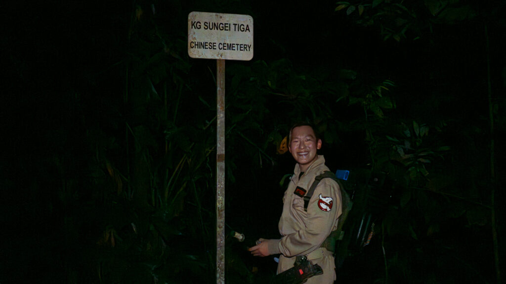 Ghostbuster in front of Chinese Cemetery sign
