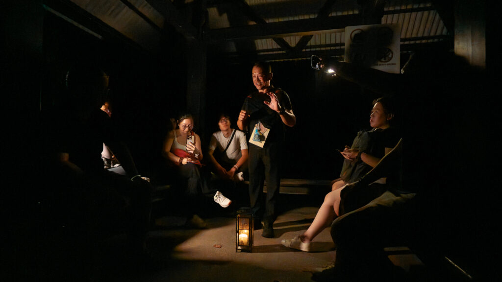 Tour Guide telling stories to tour group on ghost tour