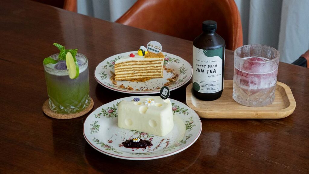 A spread of cakes and drinks at a honey themed cafe