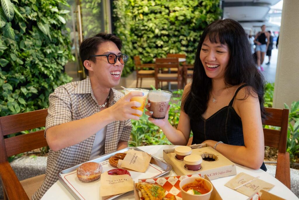 Bren and Cece enjoying coffee at The Coach Coffee Shop RWS - New Things to Do in Singapore August 2025
