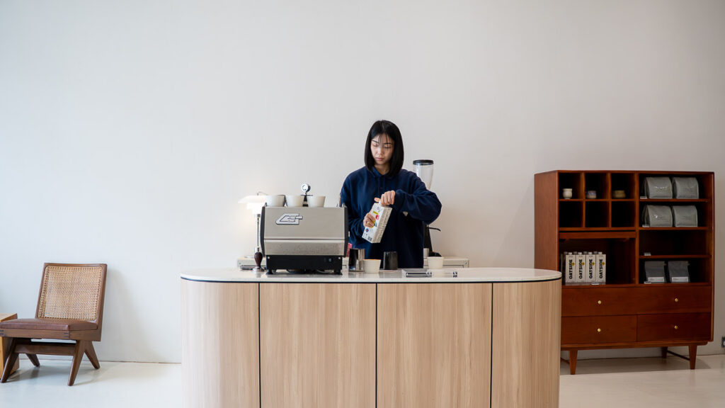 Barista Making a Latte at Brewsmith Coffee Roasters