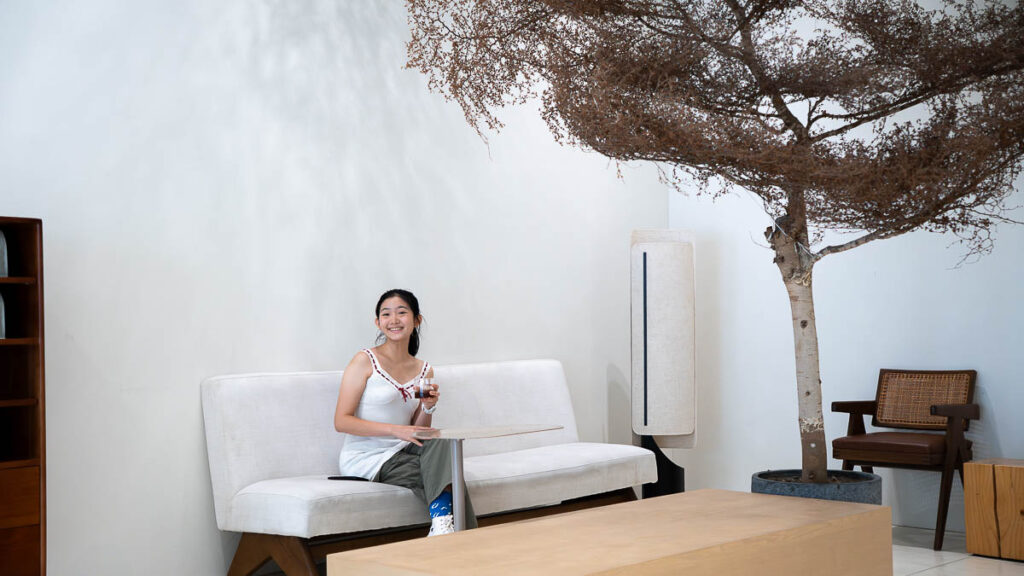 Person sitting beneath a tree at Brewsmith Coffee Roasters