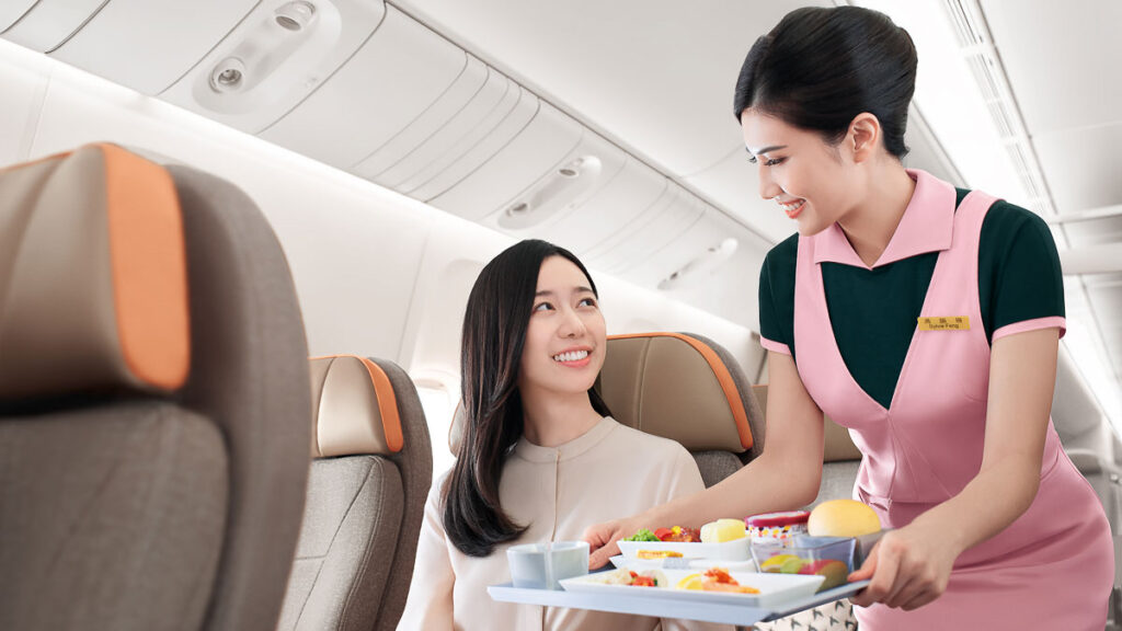 Flight Attendant Serving Food on EVA Air - Family-Friendly Things to Do in Taiwan