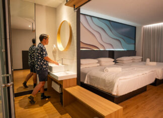 Theon using the sink in his room at Hako Hotel - Affordable jb hotels