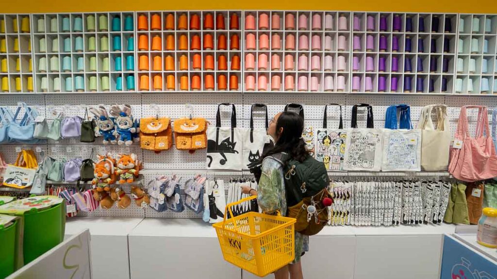 Person looking at Colourful Display of Threads and Cute Bags at KKV