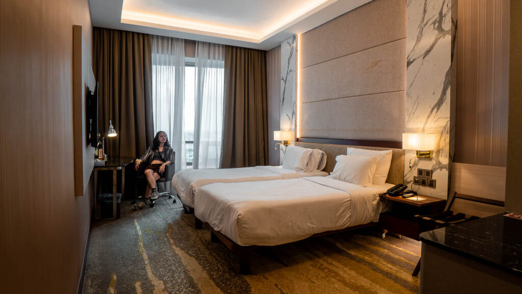 Person relaxing in a hotel room in St Giles Southkey