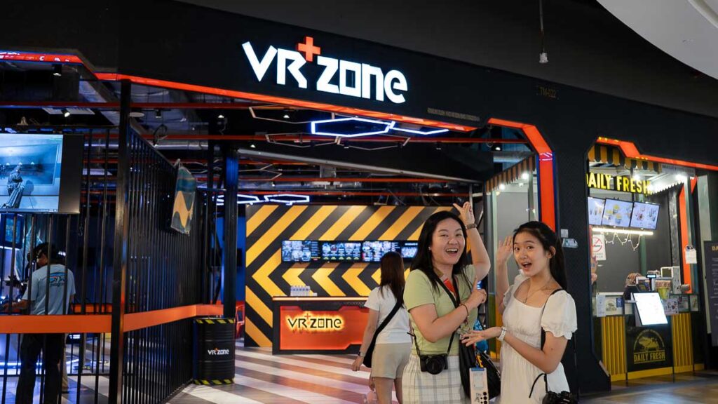 Two People In Front of VR+ Zone