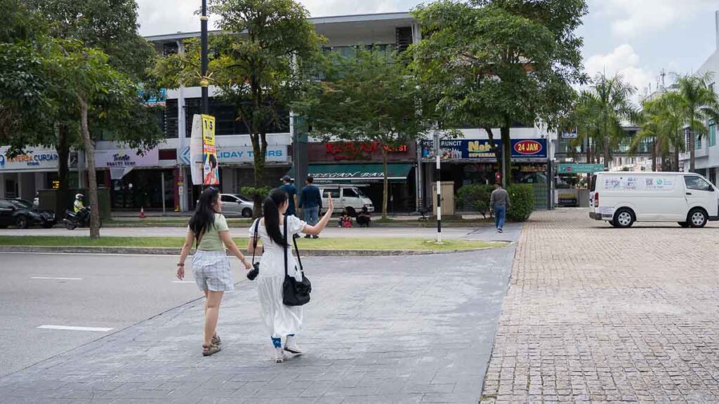2 people crossing the road at The Lakefront@Southkey