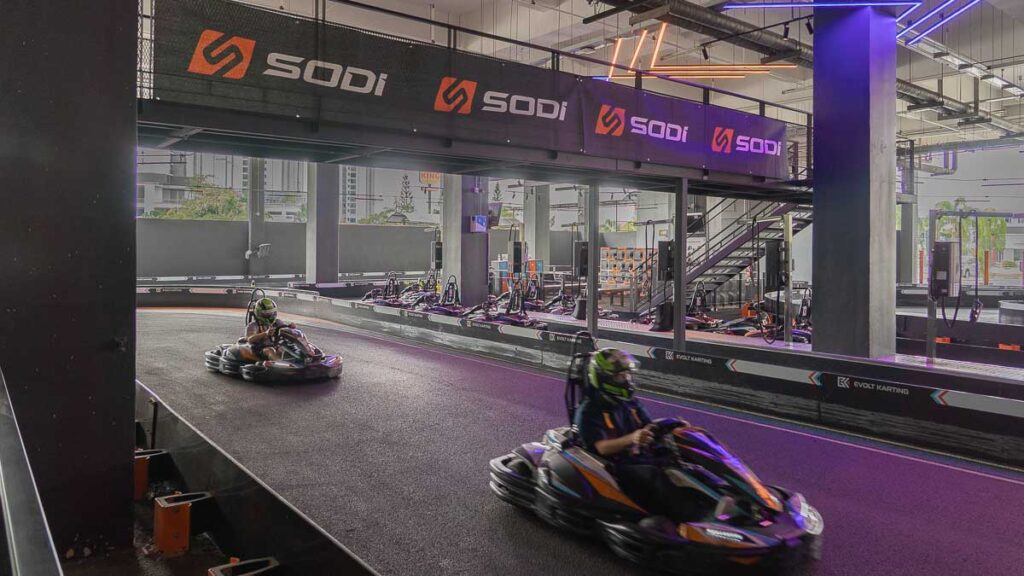 2 people go-karting on the tracks