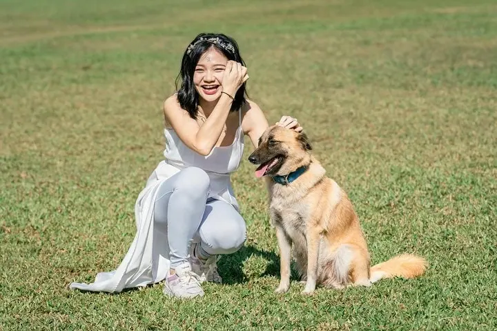 girl posing with a dog