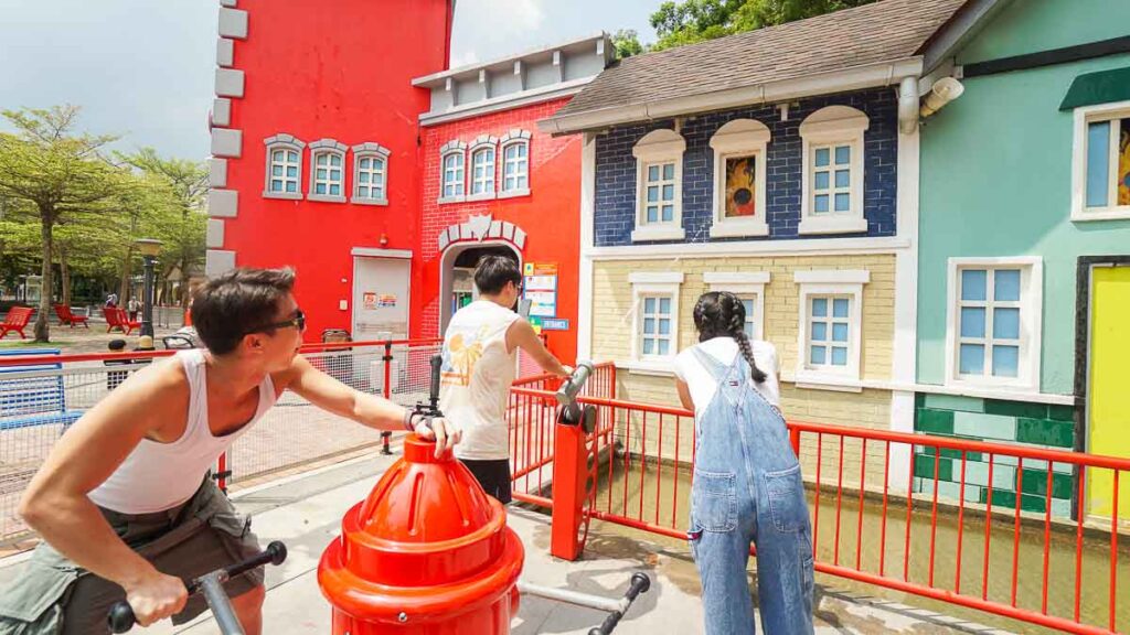 3 people playing a game in Legoland - Things to do in Legoland Malaysia