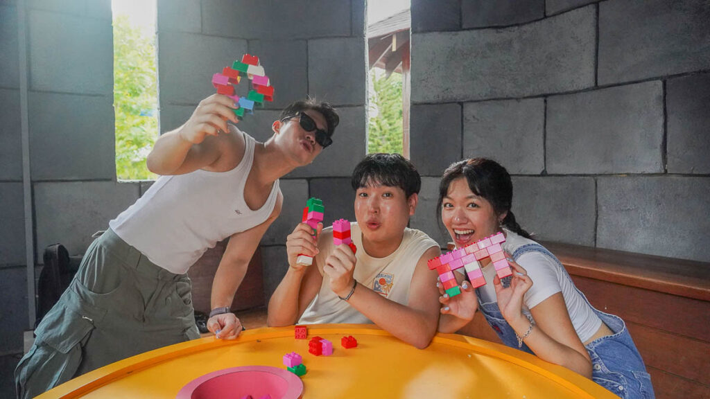 3 people posing with legos - Things to do in Legoland Malaysia