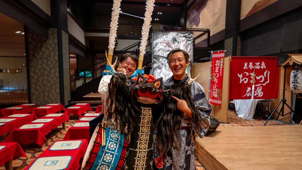 Boy holding up deer dance costume in, Iwate, Japan - Tohoku itinerary