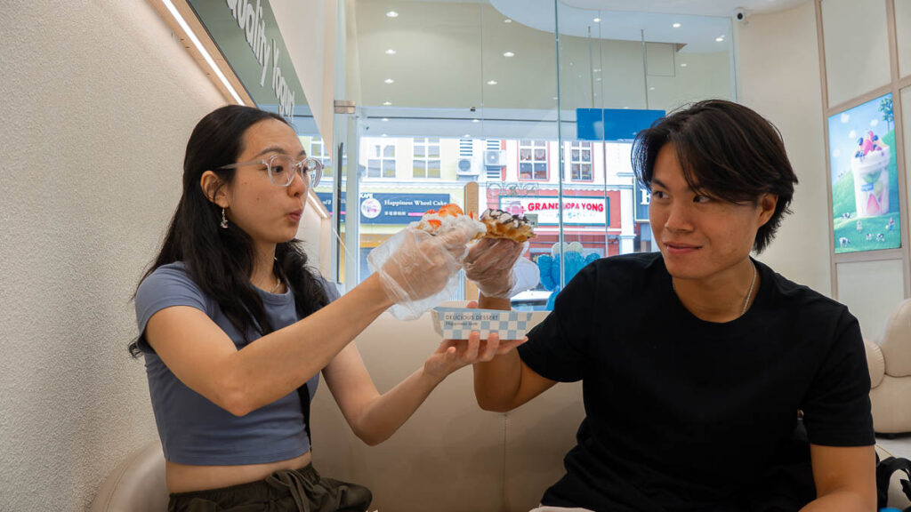 2 people enjoying croffles from Yogurt Yoogoo