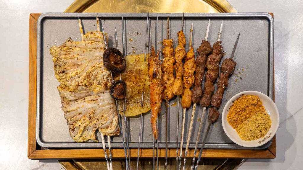 Flatlay of an assortment of skewers at Lai Lai BBQ Mount Austin