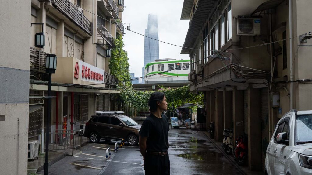 Man Taking Photo with Liziba Station Train - Things to do in Chongqing