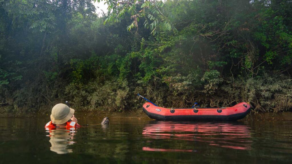 Man Floating in Kitakami River next to inflatable Raft, Iwate, Japan - Tohoku itinerary