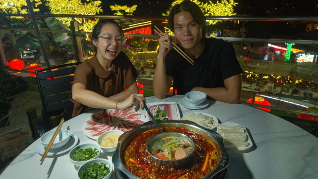 People Eating Pipa Yuan Food - Chongqing Itinerary