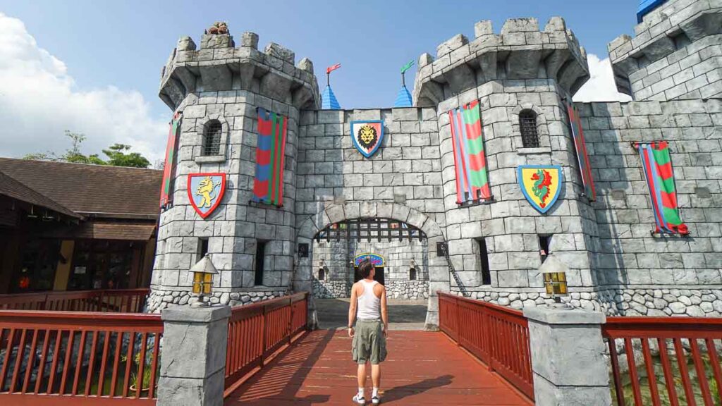 guy posing in front of castle - Things to do in Legoland Malaysia