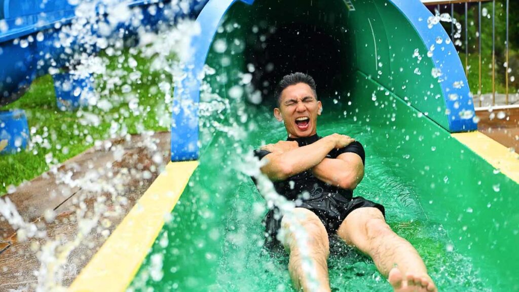 man sliding down water slide - Things to do in Legoland Malaysia