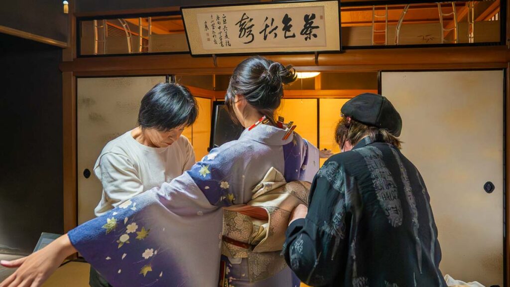 Girl getting dressed by kimono masters in Yosano - Northern Kyoto activities