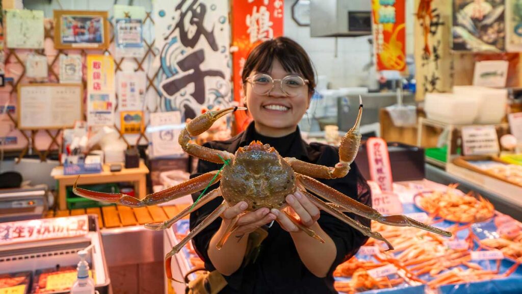 Girl holding Maizuru Crab in Tore Tore Center - Kyoto by the Sea