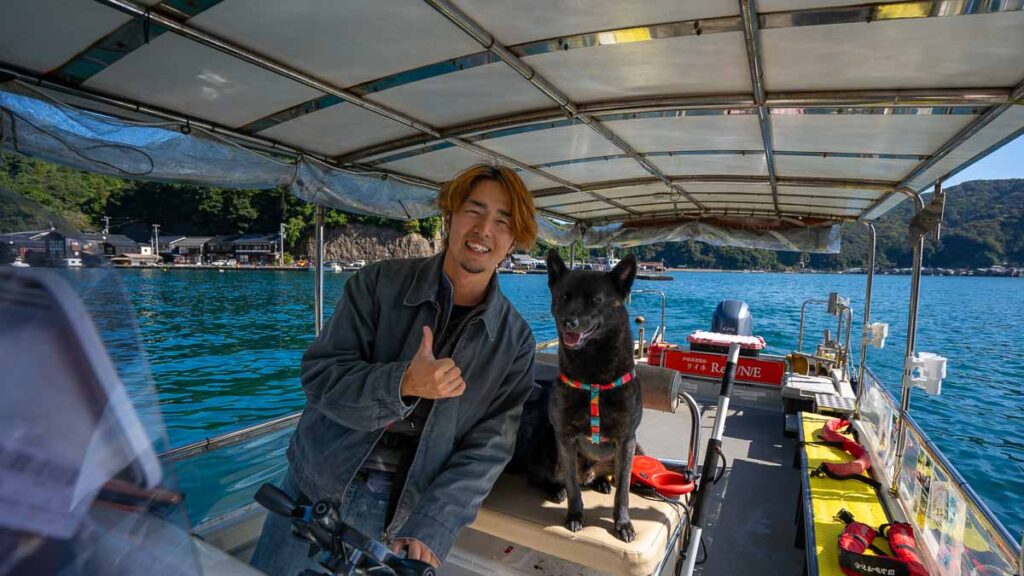Boat captain and his dog in Ine - Things to do in Ine
