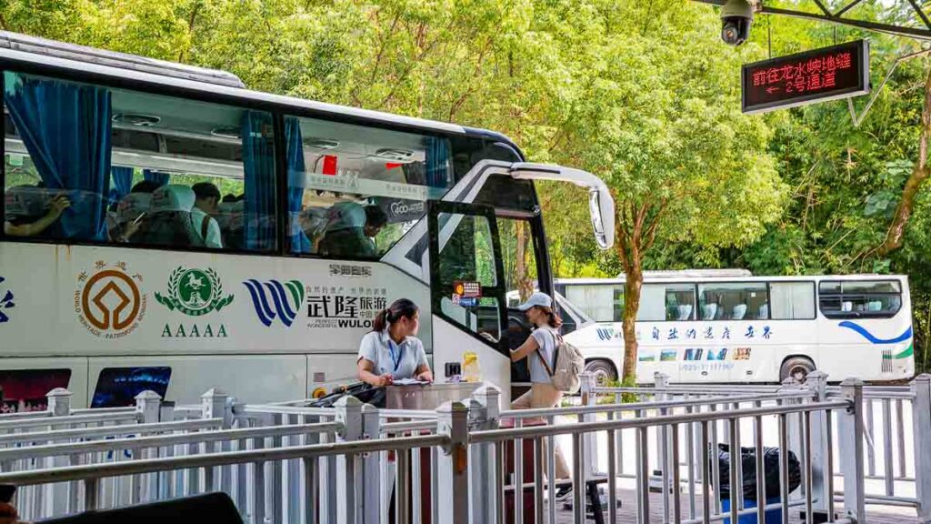 Person getting on the shuttle bus ferrying tourists within Wulong Karst National Geological Park