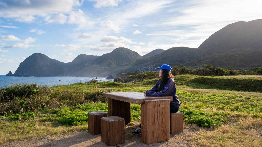 Girl sitting at table at Onaru Kofun Observatory - Things to do in Kyotango