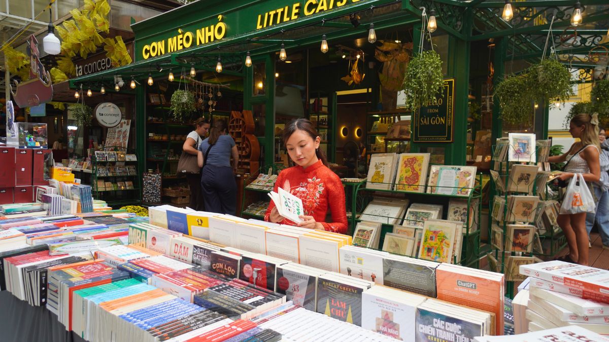 Girl browsing books at HCMC Book Street - Sightseeing in Ho Chi Minh City
