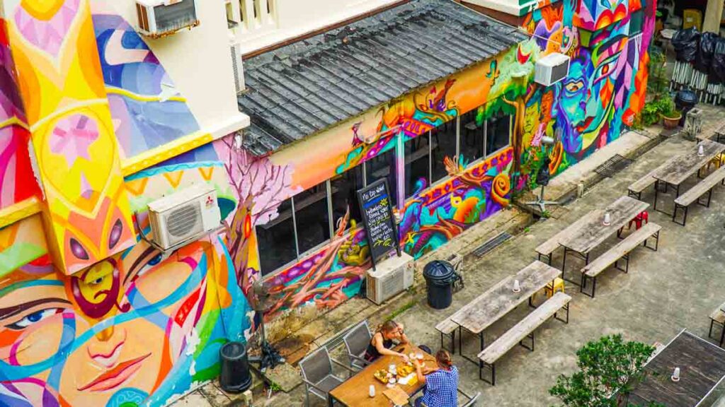 Courtyard view overlooking wall with colourful murals - Pearl's Hill Terrace Singapore