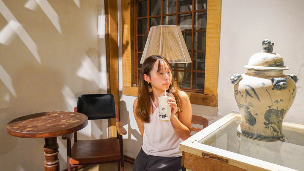 Girl drinking drink - Best cafes in Ho Chi Minh City