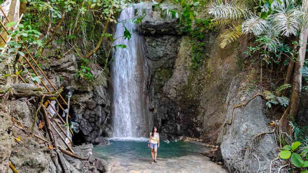 Girl in front of Magongawong Waterfall on Samal Island - Davao attractions