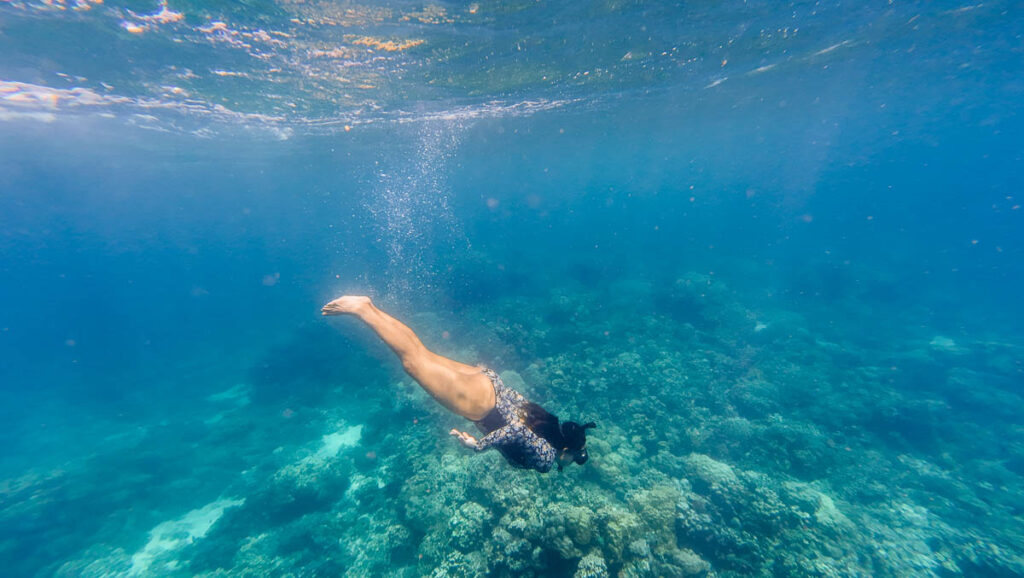 Girl snorkelling in Coral Garden in Samal Isalnd Hopping tour - Davao attractions