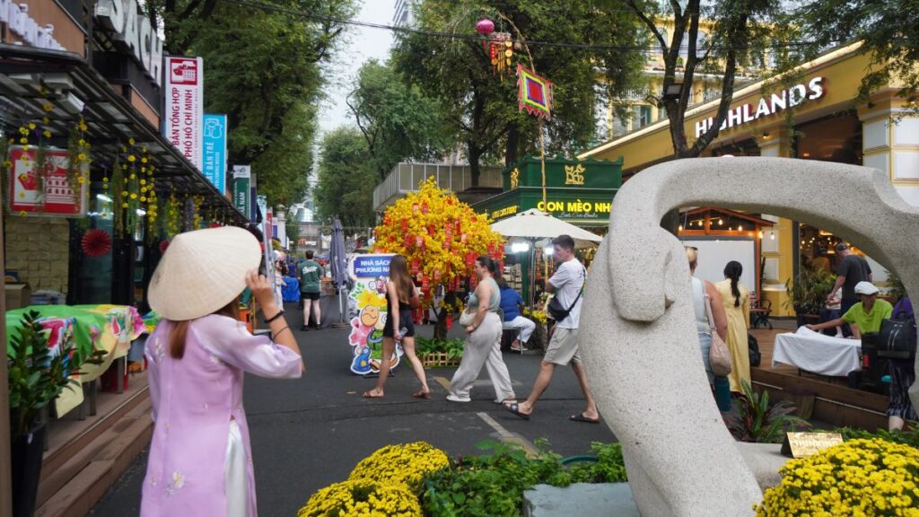 Girl in ao dai posing at Book Street - Sightseeing in Ho Chi Minh City