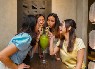 Girls drinking big matcha - Things to do in Ho Chi Minh City