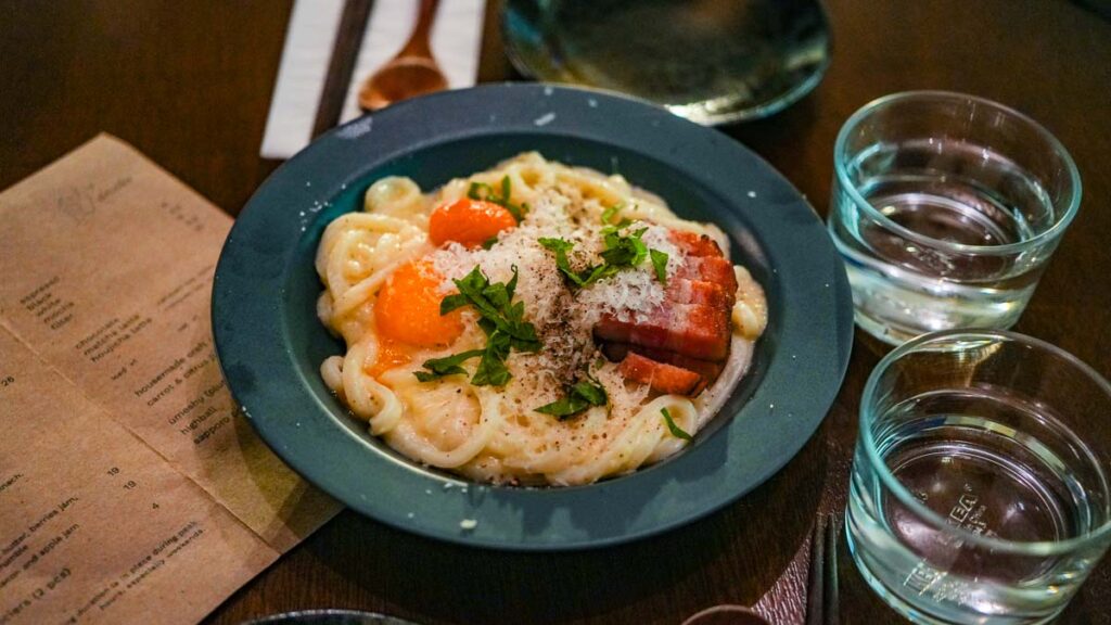Plate of carbonara udon - Things to do near Chinatown Singapore