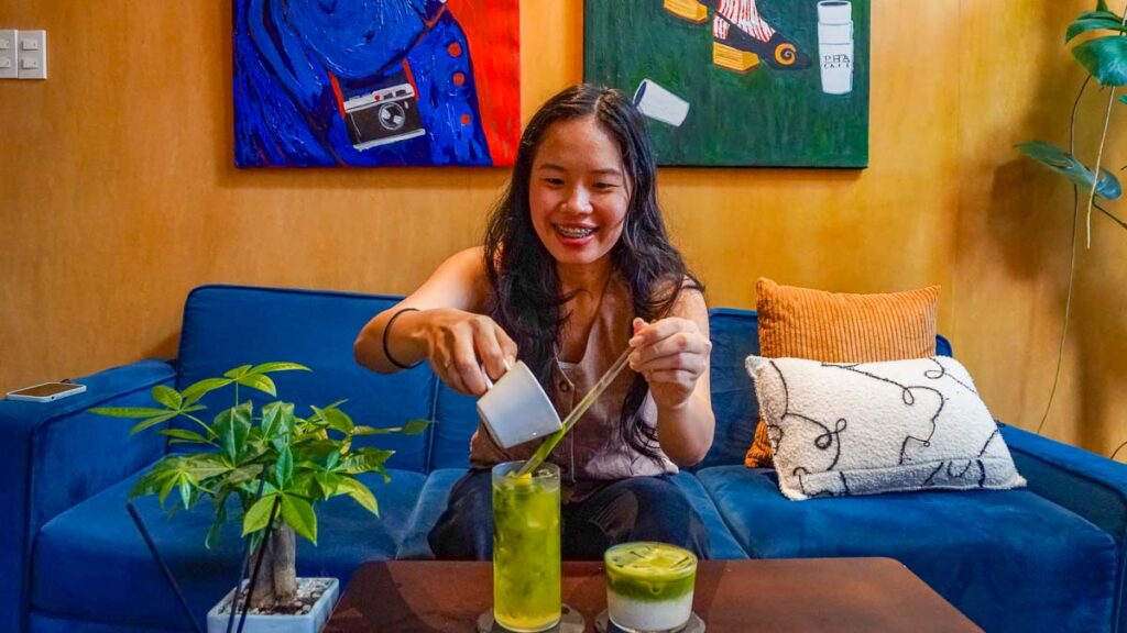 Girl pouring matcha into drink - Saigon cafes