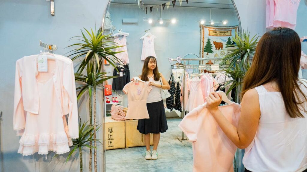 Girl Shopping At Clothes Store - Ho Chi Minh City Budget Itinerary