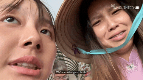Two girls with hats talking to the camera  - Ho Chi Minh City Bootcamp TTI21