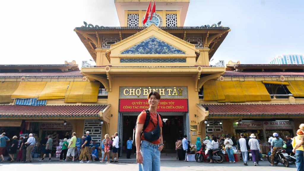 Man At A Market Exterior - Ho Chi Minh City Budget Itinerary
