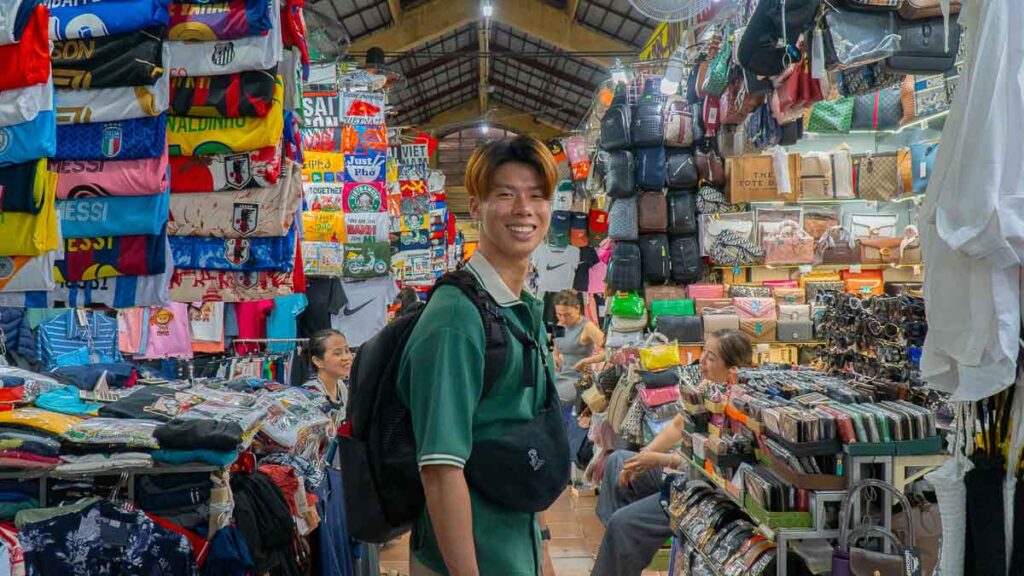 Man Standing in the middle of a Market - Ho Chi Minh City Budget Itinerary