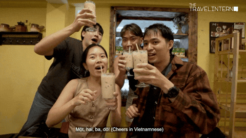 A group of people cheers with coffee - Ho Chi Minh City Bootcamp TTI21