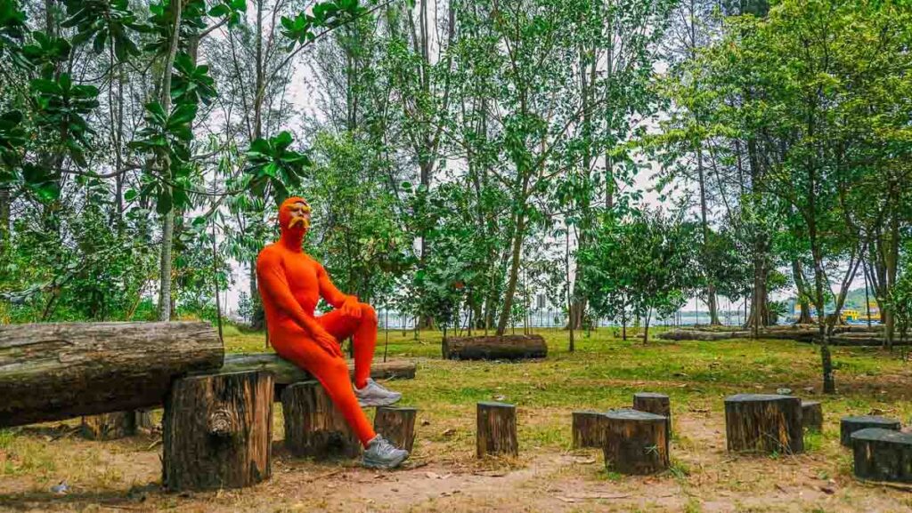 A man sitting in a park - things to do in punggol