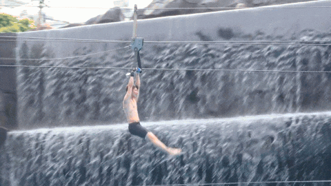 Man on a flying fox in a  Water Park - Ho Chi Minh City Bootcamp TTI21
