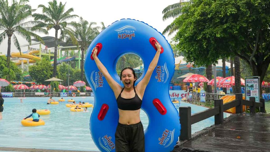 Girl holding onto a WaterPark Float - Ho Chi Minh City Budget Itinerary