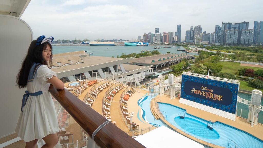 Girl at Deluxe Oceanview Stateroom with Verandah View - Where to Stay on the Disney Adventure Cruise